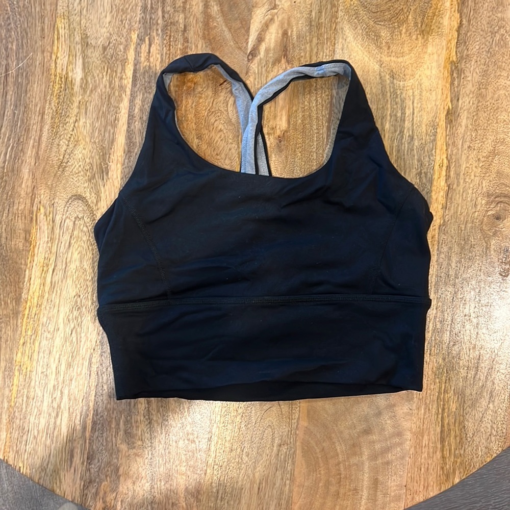 Born primitive black sports bra. Never worn